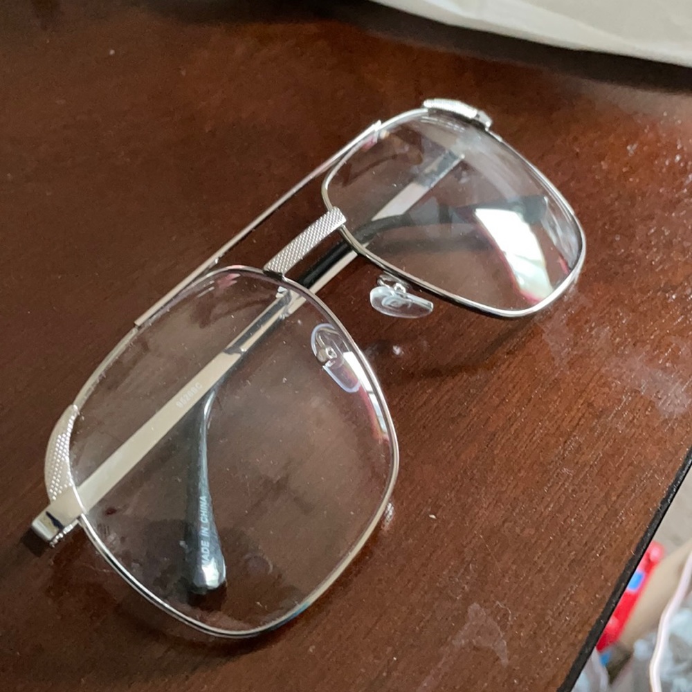 Silver frame clear glasses.